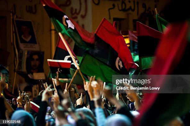 Libyan rebels and Bengazi residents celebrate the passing of a UN resolution calling for a no-fly-zone over Libyan airspace, and their belief of...