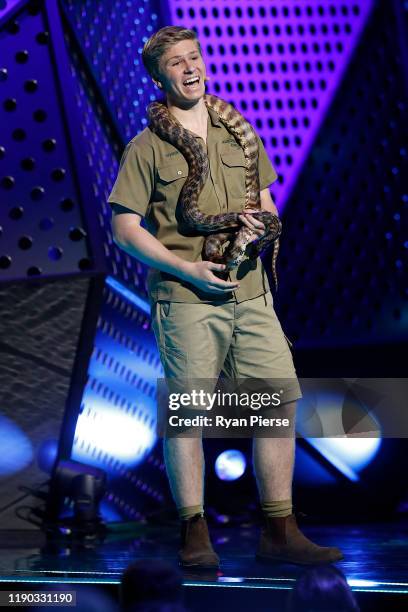 Robert Irwin holds a python on stage during the 33rd Annual ARIA Awards 2019 at The Star on November 27, 2019 in Sydney, Australia.