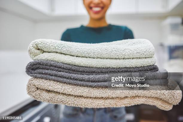 one stack of fresh, clean towels coming right up! - towel stock pictures, royalty-free photos & images