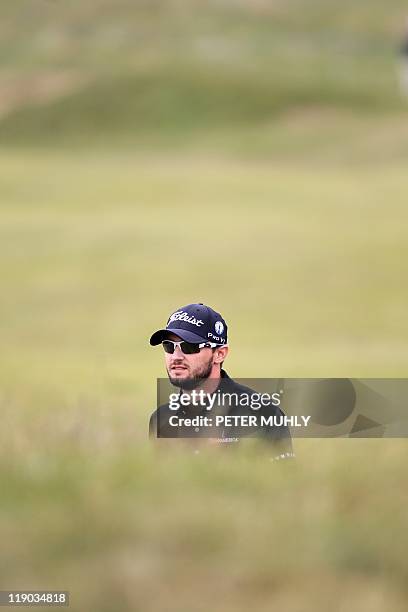 Golfer Kyle Stanley walks on the 17th fairway on the first day of the 140th British Open Golf championship at Royal St George's in Sandwich, Kent,...