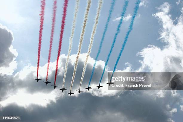 The French ''Patrouille de France'' alphajets fly colouring in the sky during the annual Bastille day parade on the Champs-Elysees on July 14, 2011...