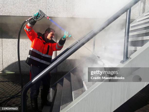 stones steps being hot pressure washed. - cleaning graffiti stock pictures, royalty-free photos & images