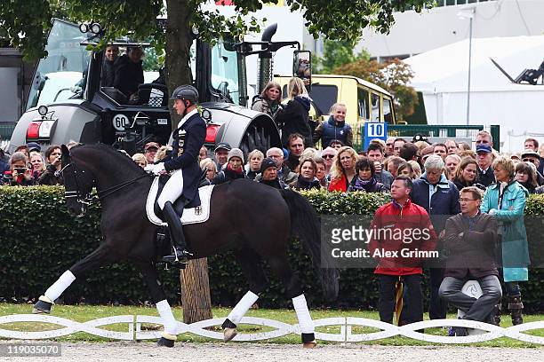 Co-owners Ann-Kathrin Linsenhoff and Paul Schockemoehle, German Dressage national coach Holger Schmezer and father Klaus-Martin Rath watch German...