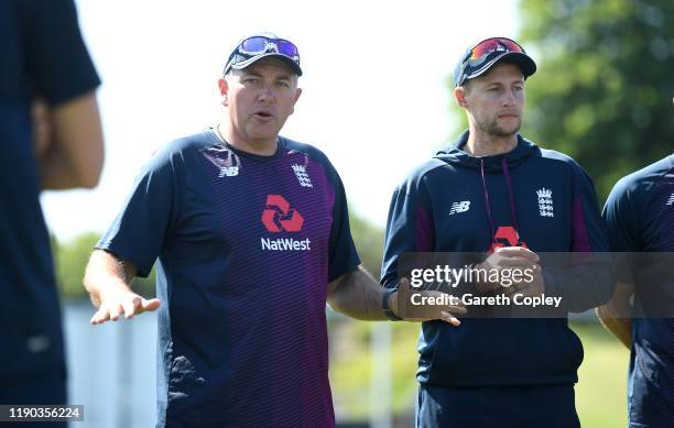 England coach Chris Silverwood and captain Joe Root speaks to their team during a nets session at Seddon Park on November 27, 2019 in Hamilton, New...