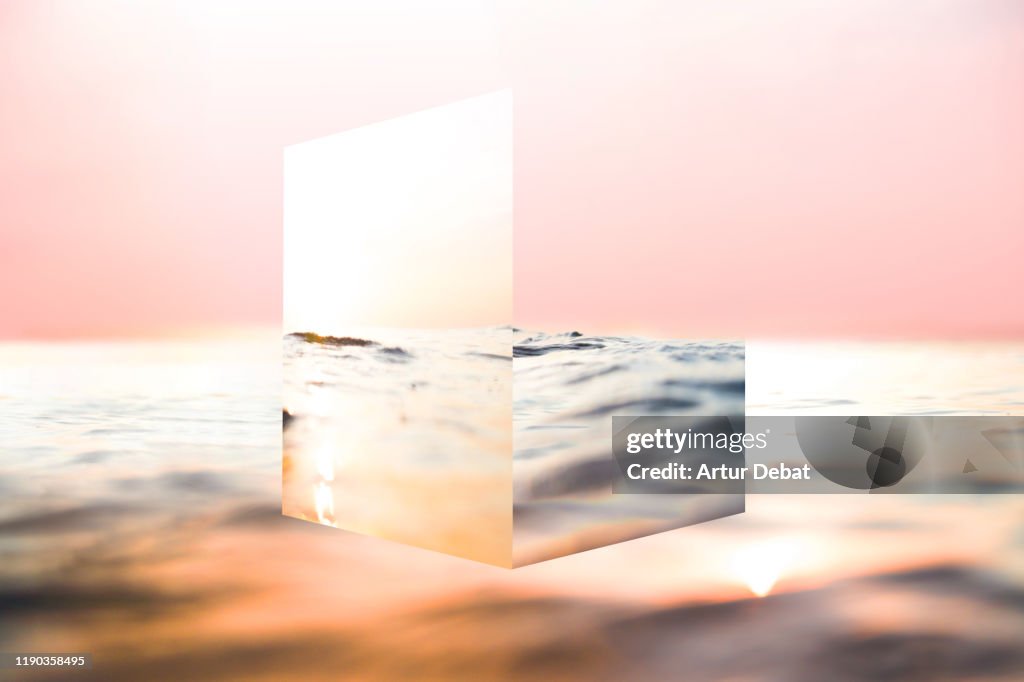 Creative cube mirror playing with the sea reflections and sunset colors.