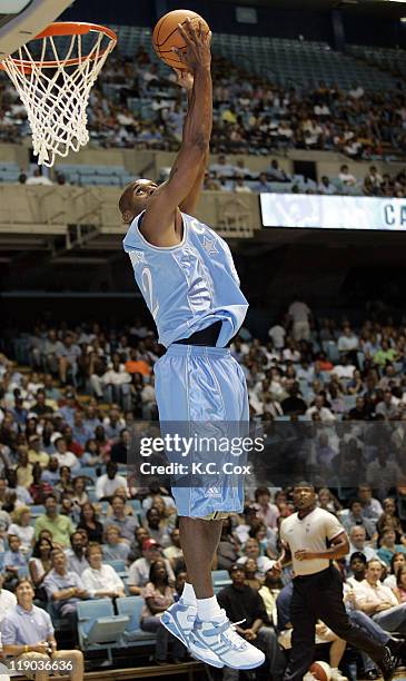 Carolina Pro Jerry Stackhouse dunks during the 4th Annual World's Greatest Alumni Basketball Game Saturday, August. 27 at the Dean E. Smith Center in...