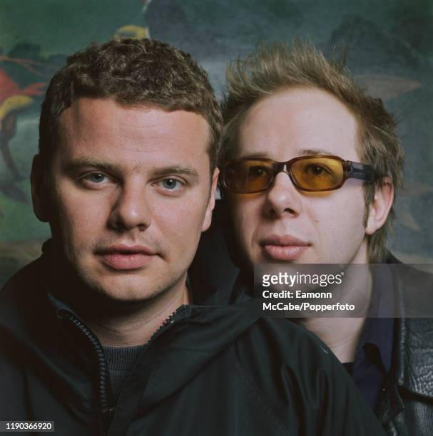 Ed Simons and Tom Rowlands of British dance music duo The Chemical Brothers, posed together in a bar circa 2002.
