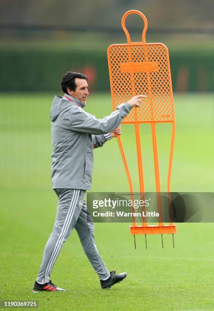 Unai Emery, Manager of Arsenal signals during an Arsenal training session on the eve of their UEFA Europa League match against Eintracht Frankfurt at...