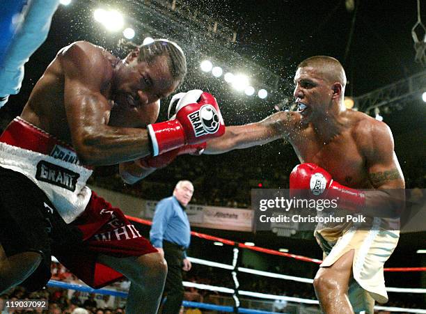 Fernando Vargas, right tan trunks, fights against Fitz Vanderpool, red trunks, during a 10-Round Junior Middleweight bout at the Grand Olympic...