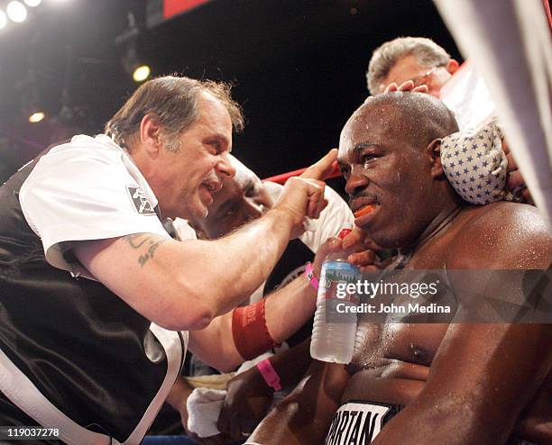 Heavyweight Robert Wiggins is attended to by a trainer during his defeat to undefeated Audley Harrison at the 'Best Damn Night Of Olympians Period'...