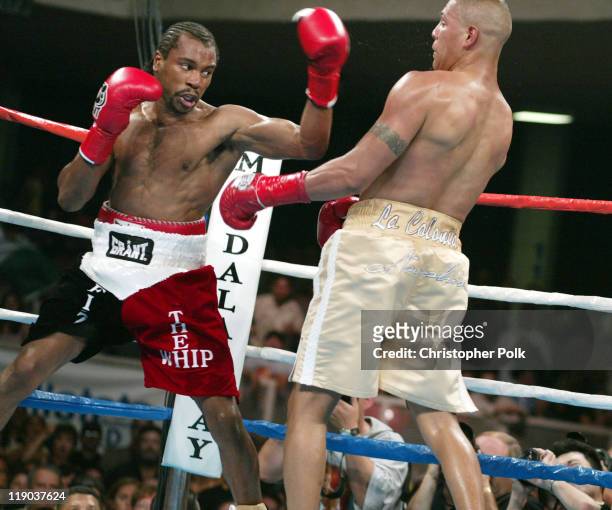 Fernando Vargas, right tan trunks, fights against Fitz Vanderpool, red trunks, during a 10-Round Junior Middleweight bout at the Grand Olympic...