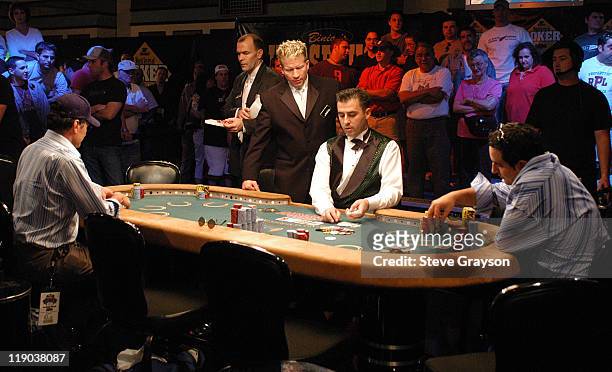 Binions Horseshoe Club and Casino dealers deal cards to constestants during day six of the 2004 World Series of Poker at Binion's Horseshoe Club and...