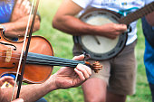 Violin and banjo played outdoors in a popular country party,jpg