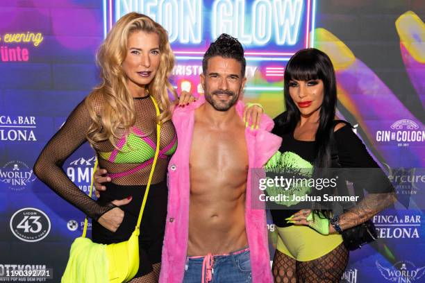 Giulia Siegel, Marc Terenzi and Gina Lisa Lohfink are seen during the McWonderland Neon Glow Christmas Party on November 25, 2019 in essen, Germany.