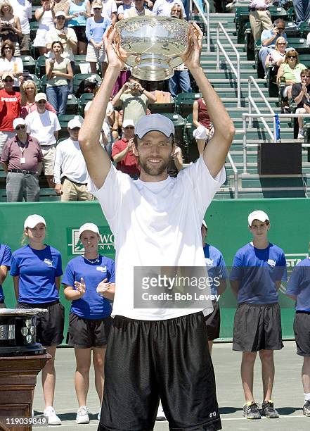 Ivo Karlovic of Croatia poses with the trophy after beating Mariano Zabaleta of Argentina during the finals of the U.S. Men's Clay Court...