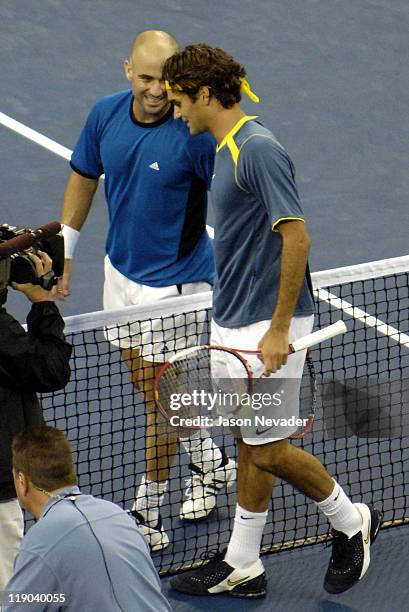 Roger Federer claims US Open Title, defeating Andre Agassi in the final 6-3, 2-6, 7-6 9, 6-1 at Arthur Ashe Stadium in Flushing, New York on...