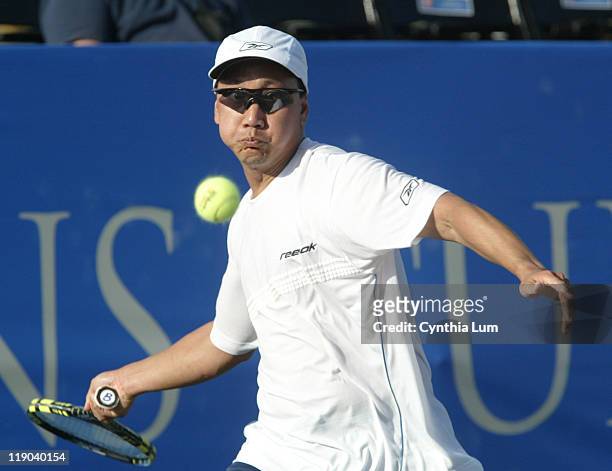 Michael Chang of the USA, in action before he has to default the match to Mikael Pernfors of Sweden after suffering an achilles tendon injury at the...