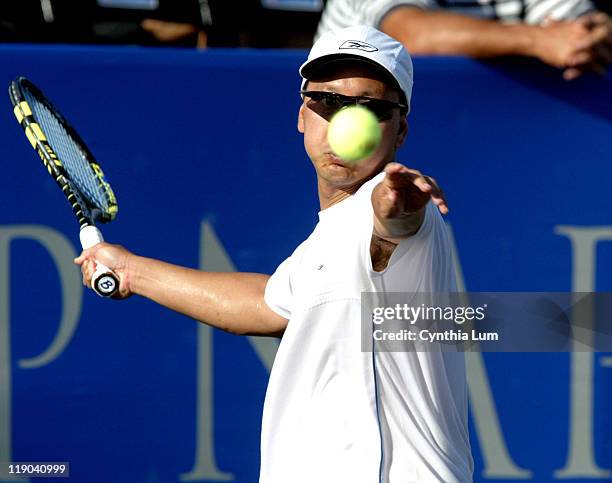 Michael Chang of the USA, in action before he has to default the match to Mikael Pernfors of Sweden after suffering an achilles tendon injury at the...