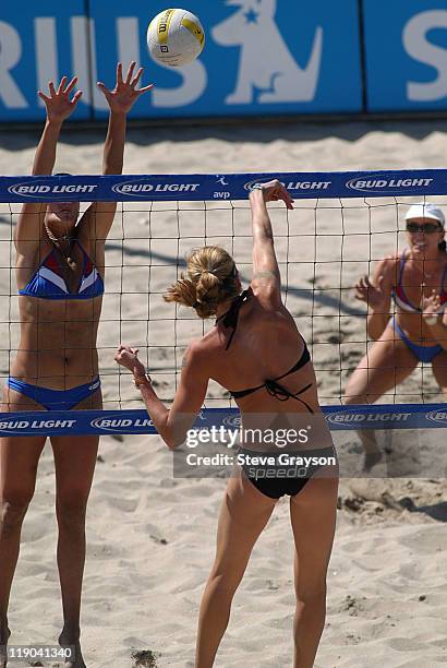 Kerri Walsh hits the winning spike in the women's final of the 2004 AVP Nissan Series Hungting Beach Open at the Huntington Beach Pier, May 30, 2004.