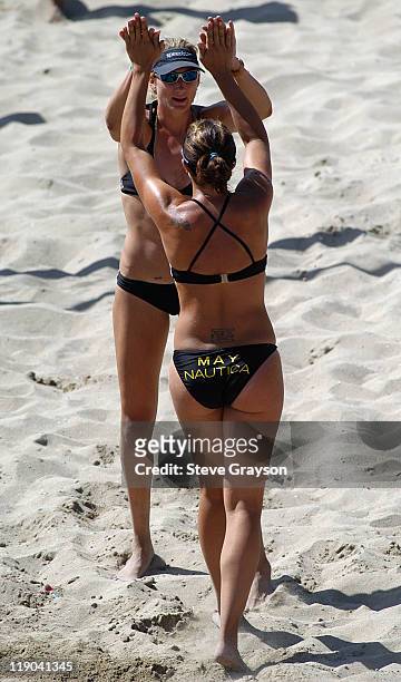 Kerri Walsh and Misty May celebrate their win over Barbara Fontana and Jennifer Kessy in the women's final of the 2004 AVP Nissan Series Hungting...