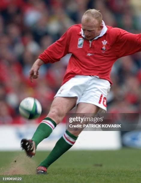 Welsh fly-half Neil Jenkins takes a penalty kick during the Rugby World Cup first round match between Wales and Samoa14 October 1999 at Cardiff...