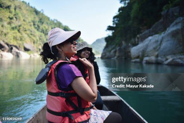 family enjoying boat ride in the river - indian family vacation stock pictures, royalty-free photos & images