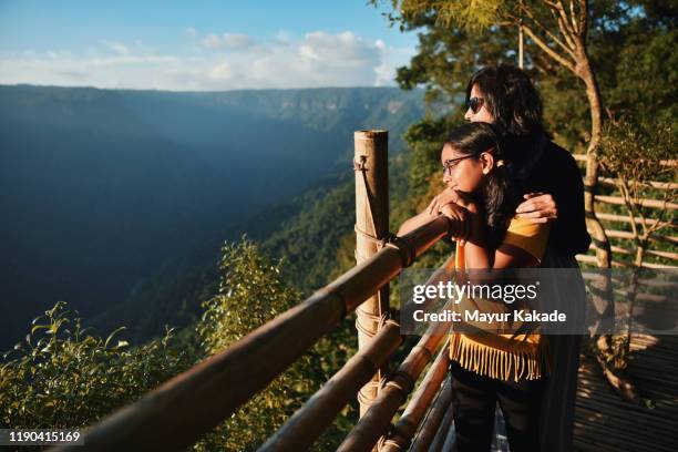 mother and daughter looking at the view - indian family vacation stock pictures, royalty-free photos & images
