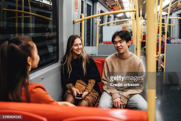 teenagers in subway train - girl sitting stock pictures, royalty-free photos & images