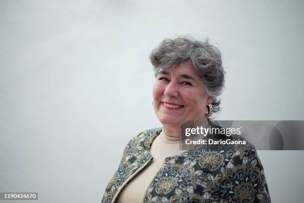 portrait of latina older woman - wavy hair stock pictures, royalty-free photos & images