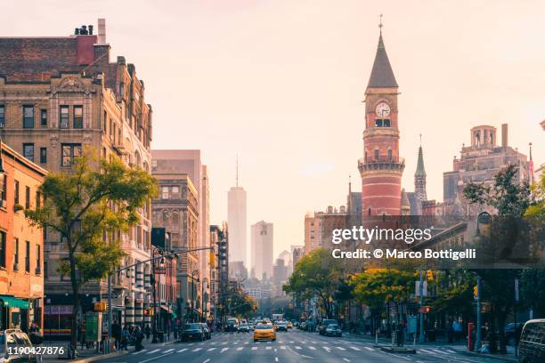 urban skyline at sunset, new york city - manhattan skyline stock pictures, royalty-free photos & images