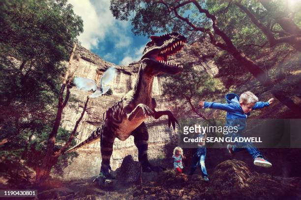 t-rex dinosaur chasing children - jurásico fotografías e imágenes de stock