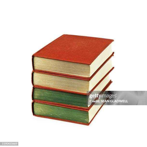 stack of four old books - libro rilegato foto e immagini stock