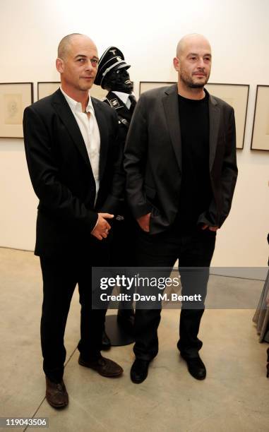Artists Dinos Chapman and Jake Chapman attend a private viewing of their new exhibit 'Jake or Dinos Chapman' at White Cube Gallery on July 14, 2011...