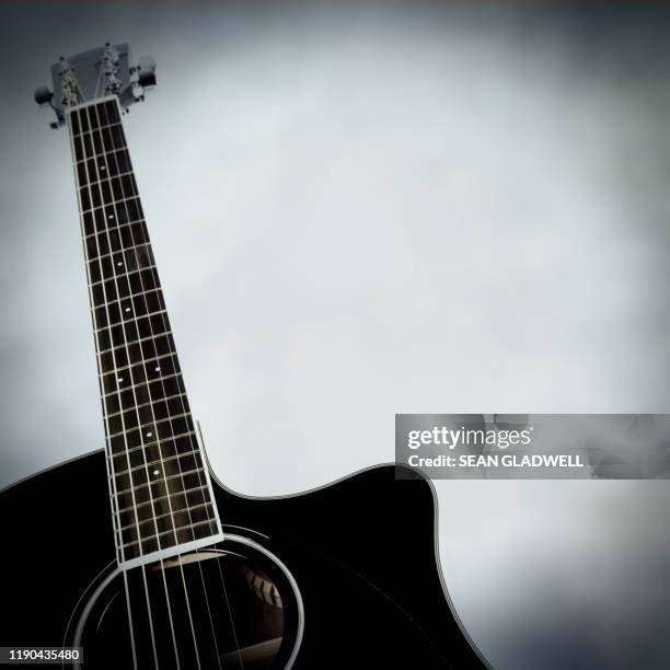 black acoustic guitar neck - country music stock pictures, royalty-free photos & images