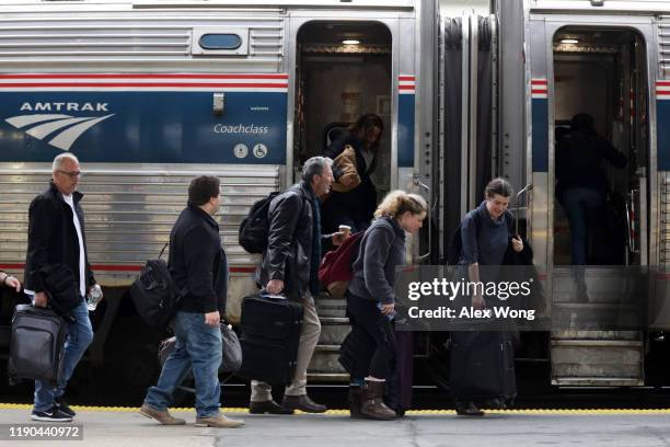 Passengers wait to board an Amtrak train November 27, 2019 at Union Station in Washington, DC. The Wednesday before Thanksgiving is expected to be...