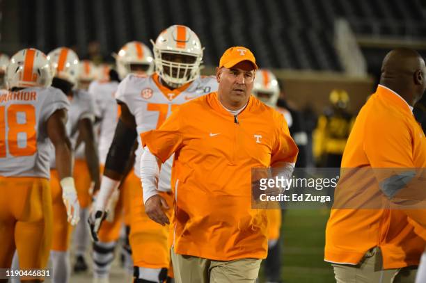 Head coach Jeremy Pruitt of the Tennessee Volunteers leads his team to the field against the Missouri Tigers at Memorial Stadium on November 23, 2019...