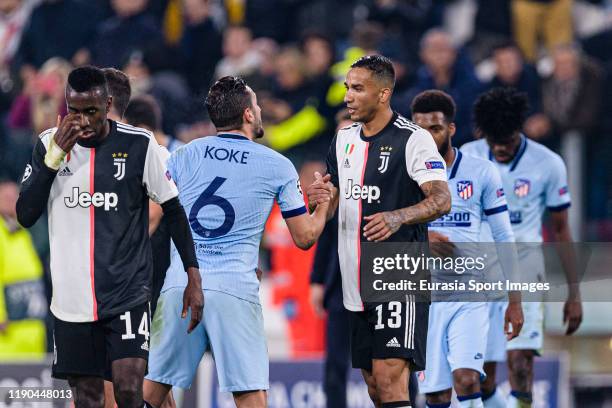 Jorge Koke of Atletico shake hands with Danilo da Silva of Juventus during the UEFA Champions League group D match between Juventus and Atletico...