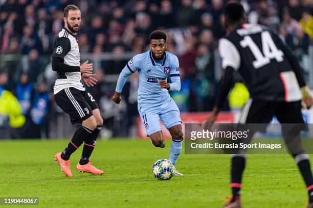 Thomas Lemar of Atletico de Madrid runs with the ball during the UEFA Champions League group D match between Juventus and Atletico Madrid at Juventus...