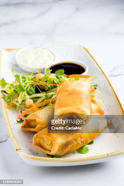 springrolls with soy sauce - spring rolls stock pictures, royalty-free photos & images