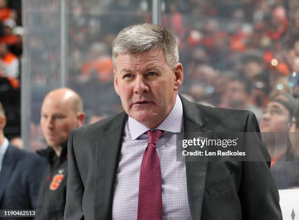 Head Coach of the Calgary Flames Bill Peters looks on during his team's game against the Philadelphia Flyers on November 23, 2019 at the Wells Fargo...