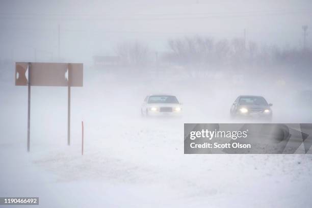 Snow blows across a road on November 27, 2019 near Rudd, Iowa. A winter storm, which dumped rain, ice, snow and brought high winds into much of the...