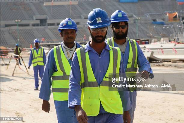 Construction workers in the Lusail Iconic Stadium in Doha, Qatar. Venue for the FIFA Qatar World Cup 2022, Doha, Qatar on December 21, 2019 in Doha,...