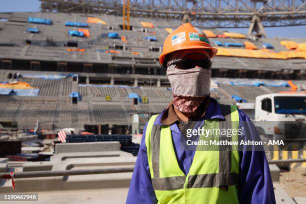 Construction workers in the Lusail Iconic Stadium in Doha, Qatar. Venue for the FIFA Qatar World Cup 2022, Doha, Qatar on December 21, 2019 in Doha,...