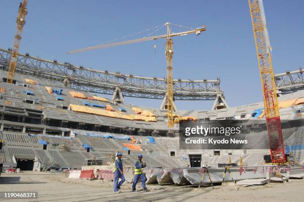 Photo taken Dec. 20 in Doha, shows Lusail Stadium -- which is scheduled to host the opening and final matches of the 2022 FIFA World Cup -- under...