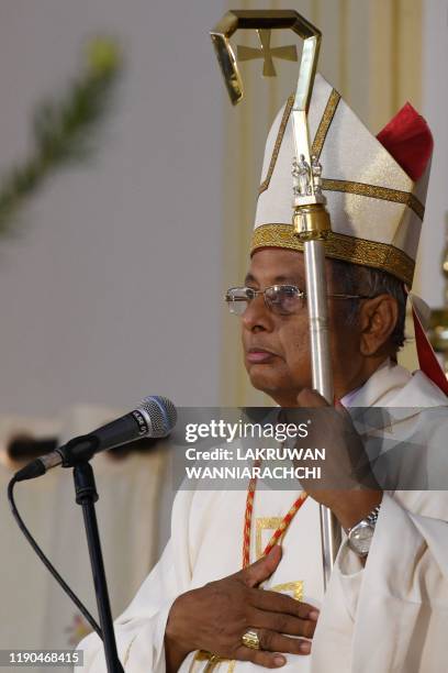 Archbishop of Colombo Malcolm Ranjith attends the Christmas Eve midnight mass at St. Sebastian's Church in Negombo on December 25, 2019. Archbishop...