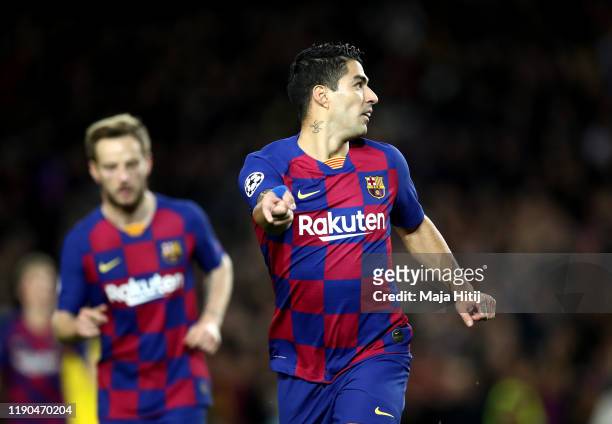 Luis Suarez of FC Barcelona celebrates after scoring his team's first goal during the UEFA Champions League group F match between FC Barcelona and...