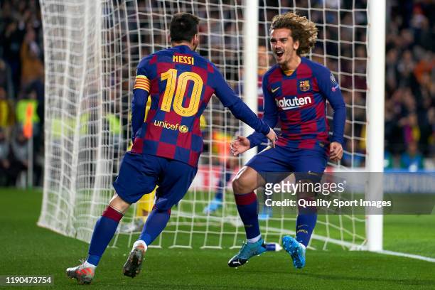 Lionel Messi of FC Barcelona celebrates with Antoine Griezmann of FC Barcelona after scoring his team's second goal during the UEFA Champions League...