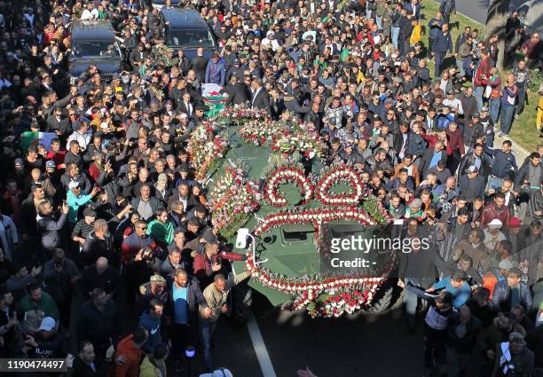 This picture taken on December 25, 2019 shows a view of the funeral of Algeria's late military chief Lieutenant general Ahmed Gaid Salah in the...