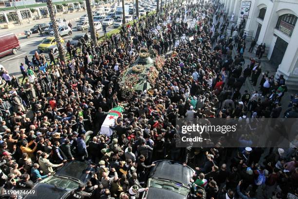 This picture taken on December 25, 2019 shows a view of the funeral of Algeria's late military chief Lieutenant general Ahmed Gaid Salah in the...