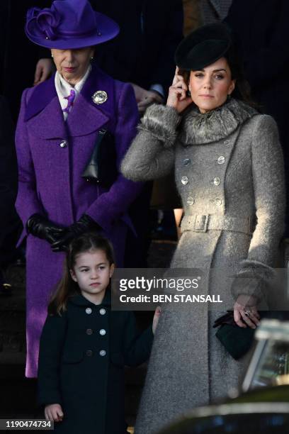 Britain's Princess Anne, Princess Royal, , Britain's Catherine, Duchess of Cambridge and Britain's Princess Charlotte of Cambridge greet well-wishers...